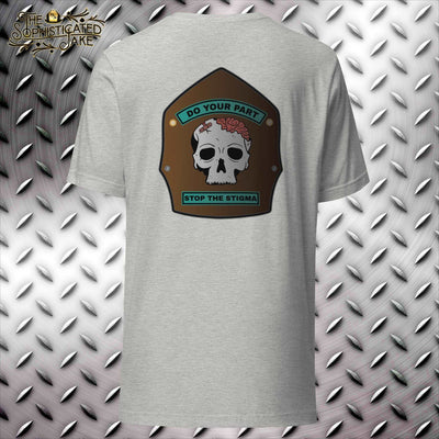 Gray t-shirt with a brown firefighter helmet shield.  On the shield is a picture of a skull with bandaid on it and the caption do your part stop the stigma.