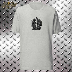 Grey t-shirt with a center design on the chest of a firefighter's helmet shield that is distressed.  The center of the shield has a graphic of a semicolon with the maltese cross incorporated at the top.
