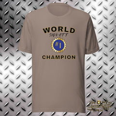 Tan t-shirt with graphic in the center of the chest.  Graphic reads, "World sign-off champion", and has a number 1 and blue ribbon in the center.
